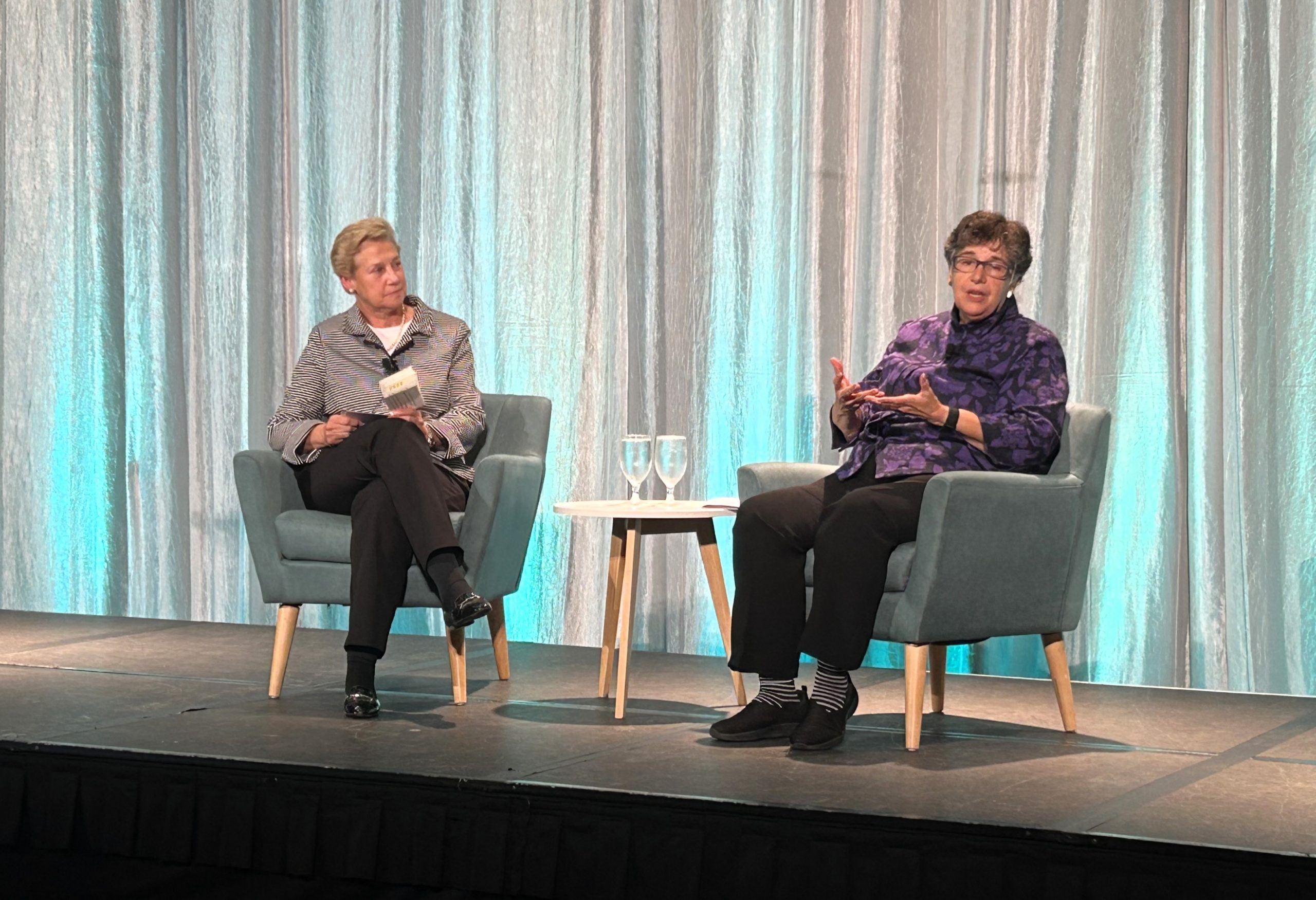 Ana Mari Cauce and Ada Healey on stage at the Seattle Metro Chamber annual meeting.